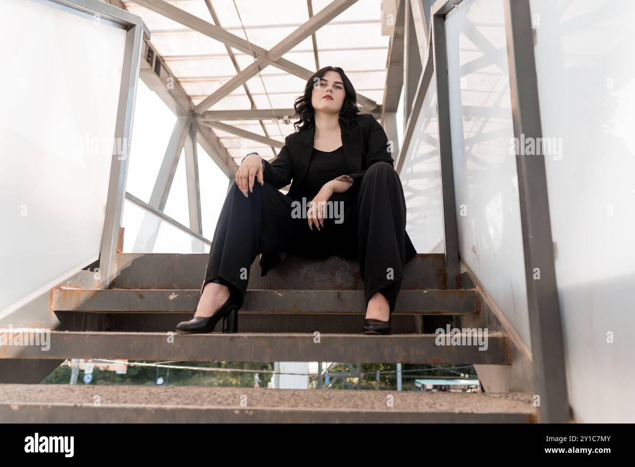 Professional woman in black suit hi-res stock photography and images ...