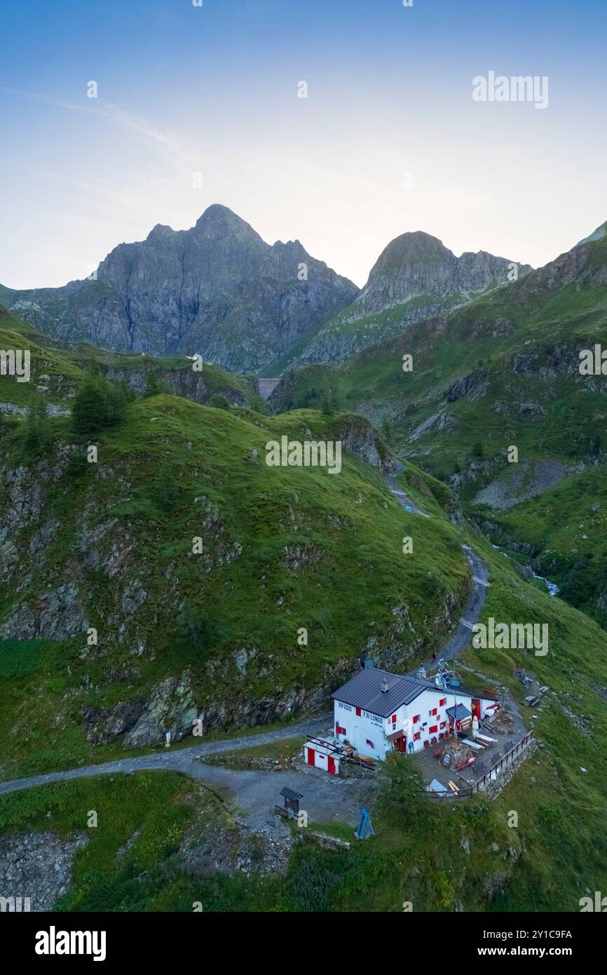 Aerial view of Longo refuge and Monte Aga at dawn in summer. Carona, Val Brembana, Alpi Orobie, Bergamo, Bergamo Province, Lombardy, Italy, Europe. Stock Photo