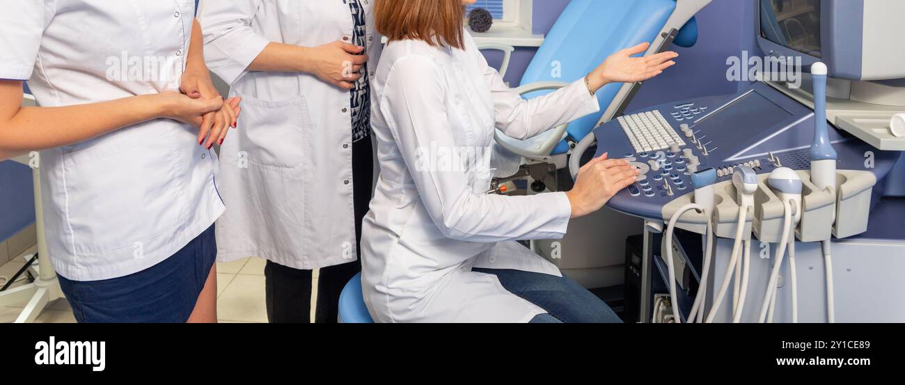 The medical council discusses the data obtained by ultrasound examination Stock Photo