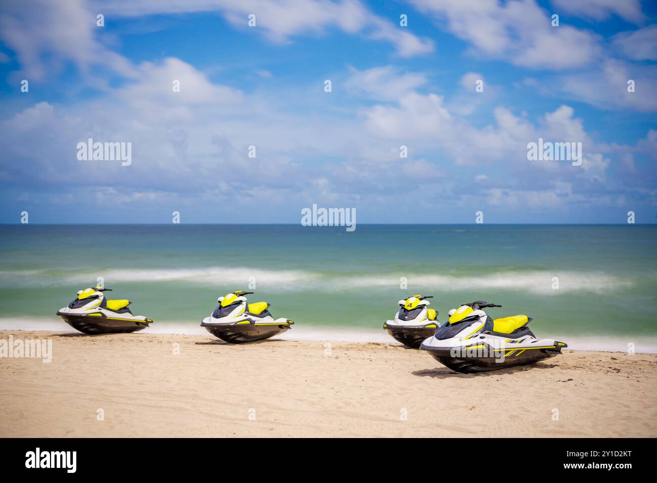 Wave runners on the beach. Summer jet ski sport rentals. Long exposure ...