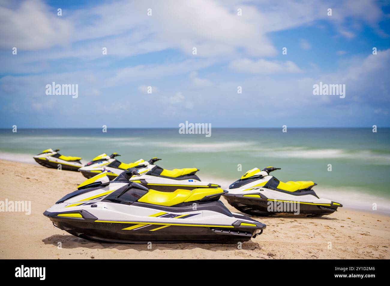 Wave runners on the beach. Summer jet ski sport rentals. Long exposure ...