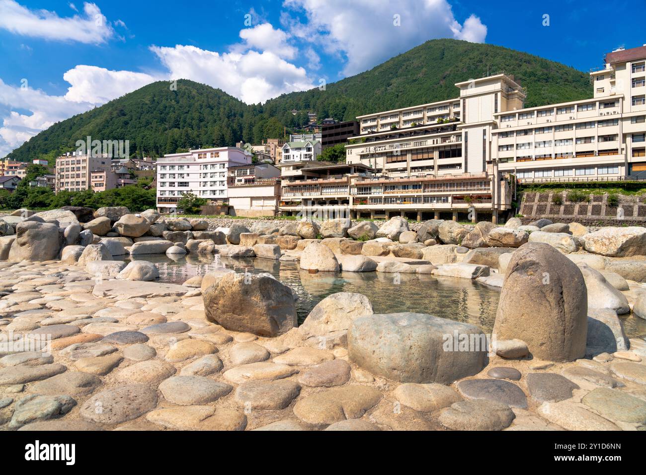 Gero, Gifu, Japan at the outdoor public stone foot bath with bathhouses in the background. Stock Photo