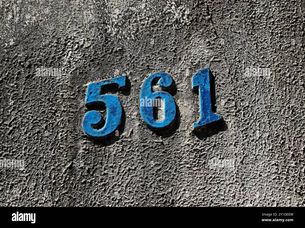 Street sign number 561 on a grey wall in the Tijuca neighborhood, Rio de Janeiro, Brazil Stock Photo