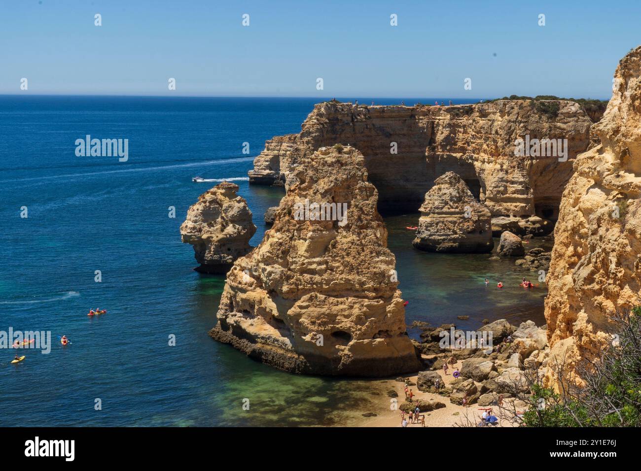 Oddly shaped jagged rock formations and cliffs at Lagoa Beach, Faro District, Southern Portugal. Stock Photo