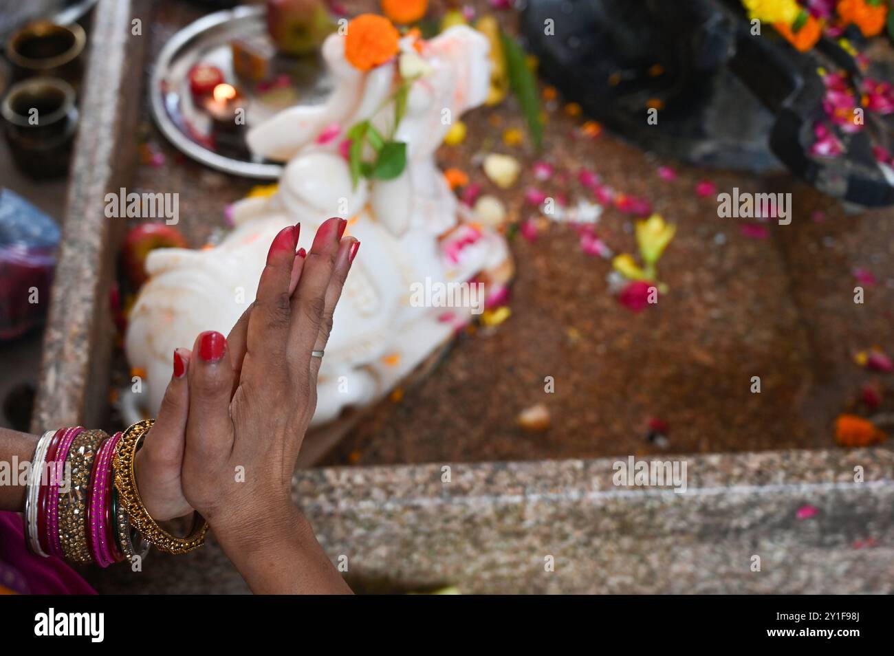 India. 06th Sep, 2024. NOIDA, INDIA - SEPTEMBER 6: Devotees worship Lord Shiva in the temple of Sector 2 on Hartalika Teej on September 6, 2024 in Noida, India. Hartalika Teej welcome the monsoon season and are celebrated primarily by girls and women, with songs, dancing and prayer rituals (Photo by Sunil Ghosh/Hindustan Times/Sipa USA) Credit: Sipa USA/Alamy Live News Stock Photo