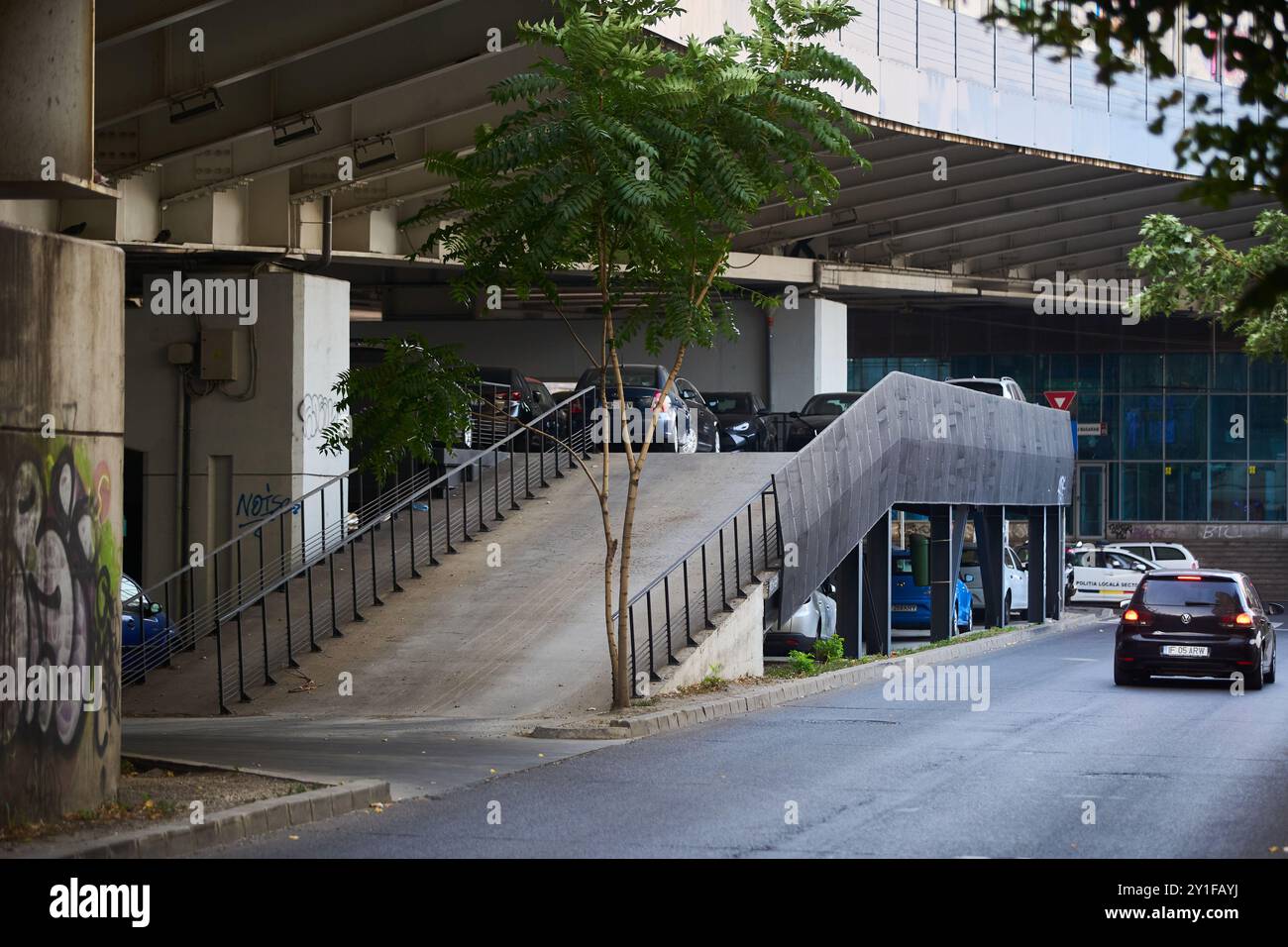 Bucharest, Romania - September 04, 2024: Multi-level parking on the metal structure in the free space under Basarab Overpass. Stock Photo