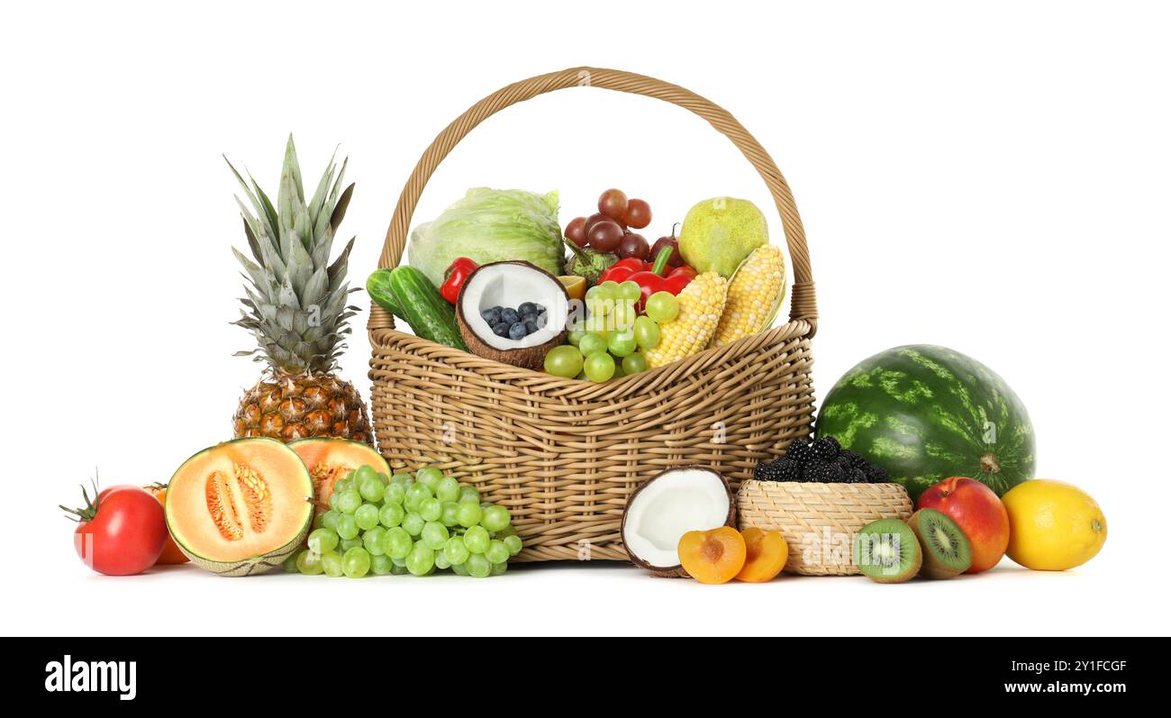 Wicker basket with different fresh vegetables and fruits isolated on ...