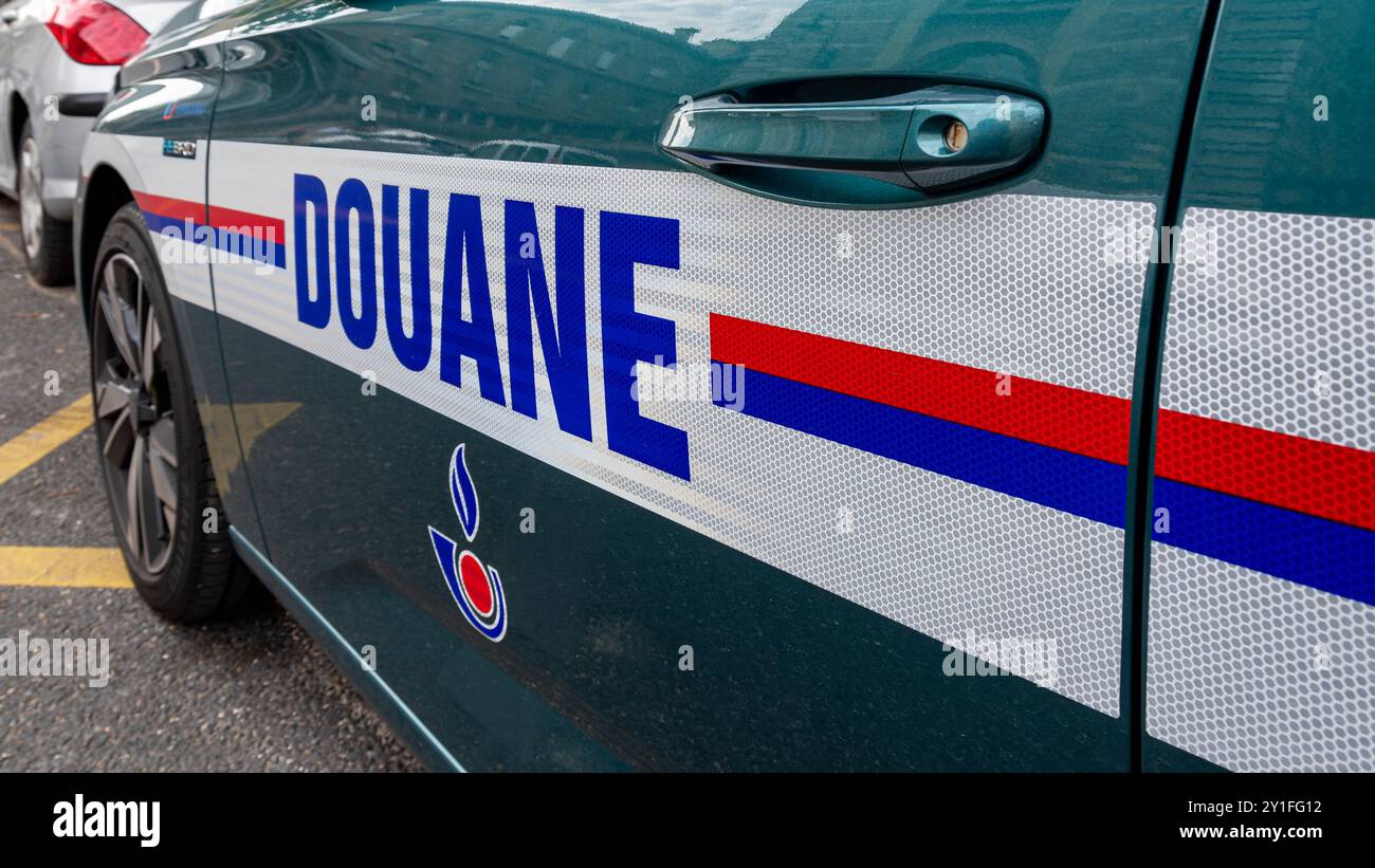 Close-up of a "Douane" marking written in French on the side of a French customs service patrol and intervention vehicle, Paris, France Stock Photo