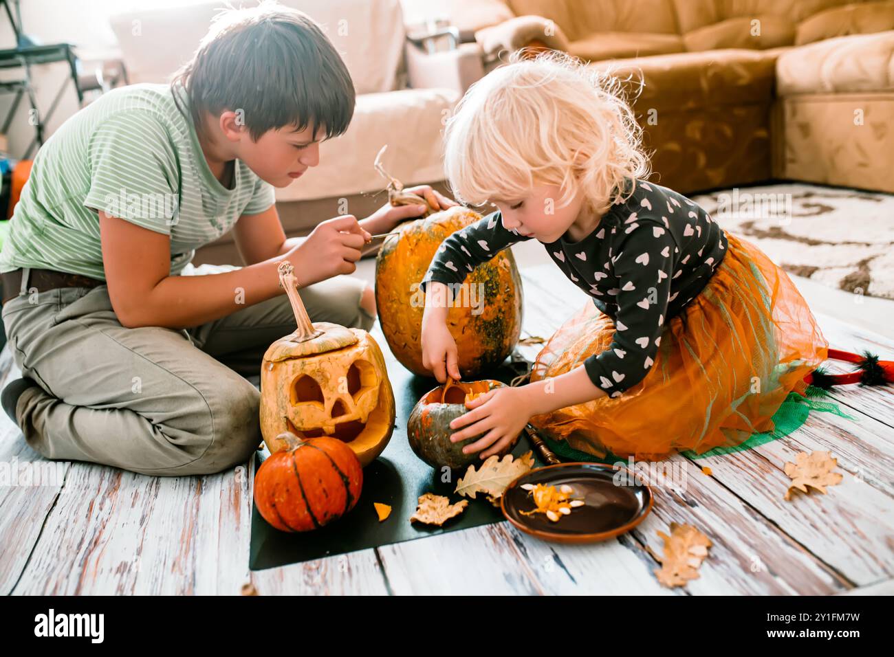 Carving a Pumpkin for Halloween. Getting ready for Halloween girl
