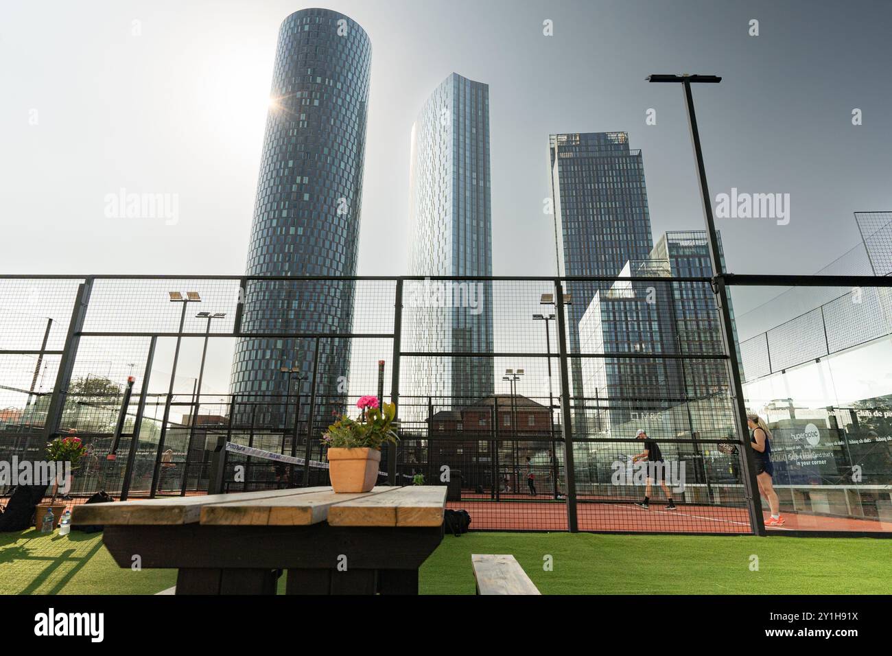 A panel court in the shadows of the Deansgate Square towers in modern Manchester Stock Photo