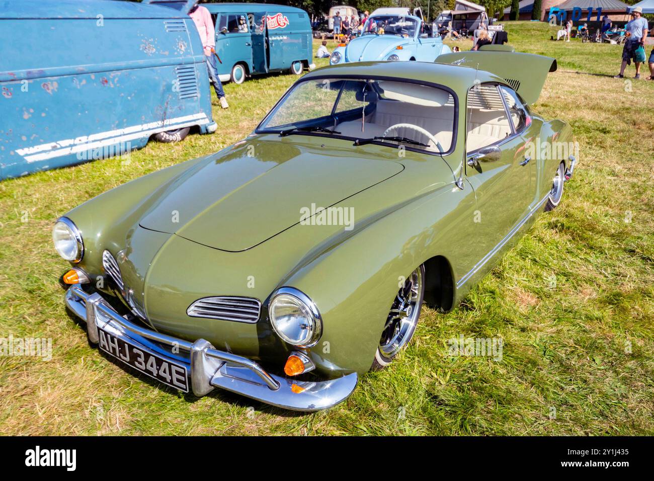 A well-preserved lowered classic green 1967 Volkswagen Karmann