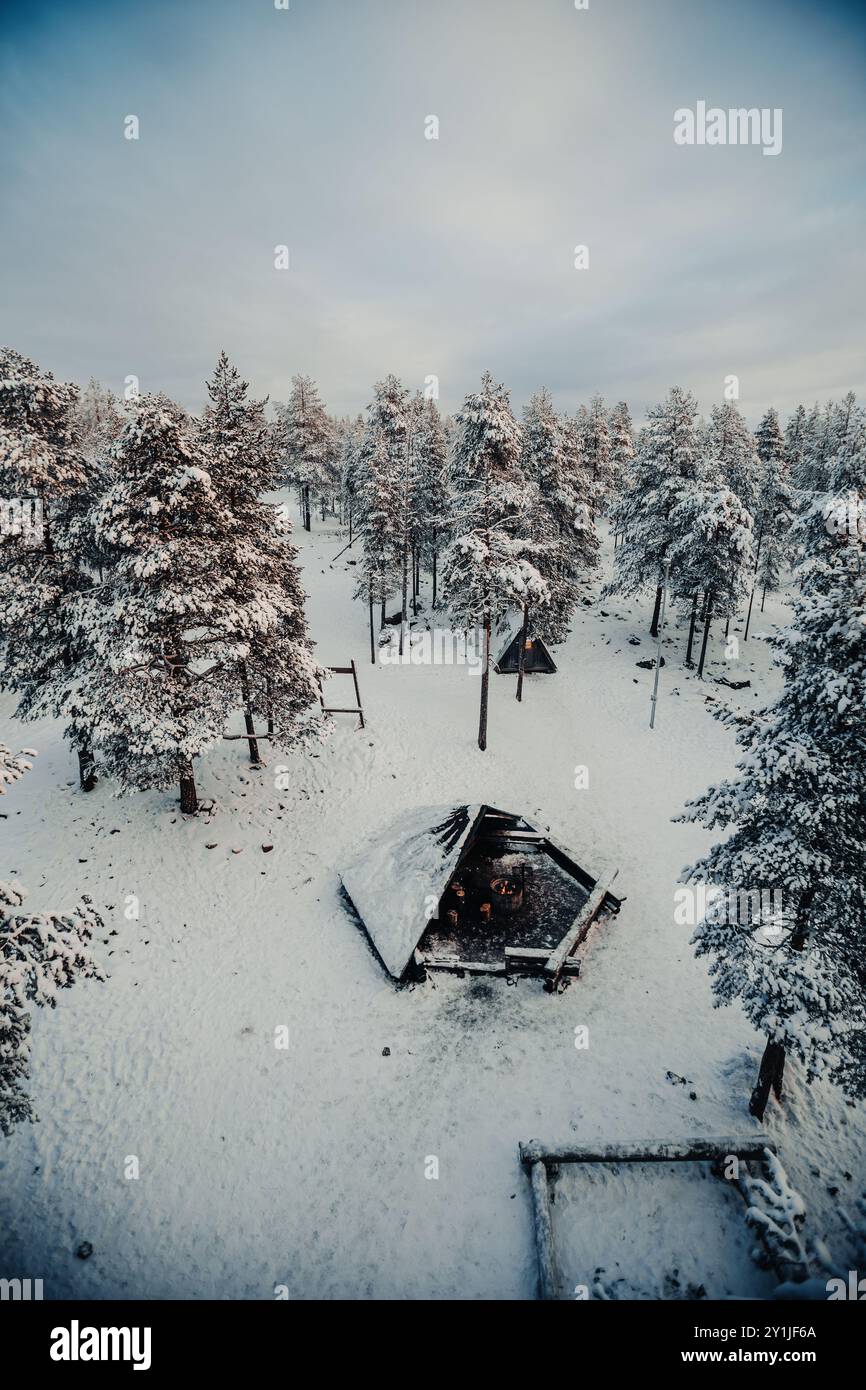 Forest Near Rovaniemi Aerial shot of laavu in snowy winter Ounasvaara forest in Rovaniemi ...
