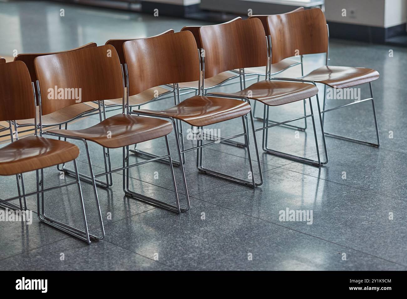 Row of empty small chairs hi-res stock photography and images - Alamy