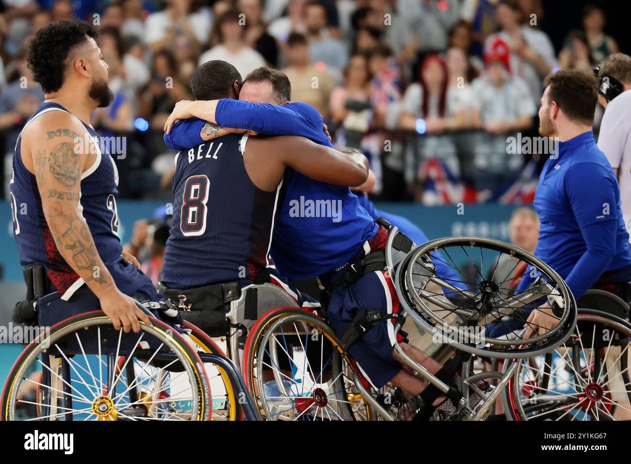 Steve Serio of the U.S., right, hugs teammate Brian Bell as they