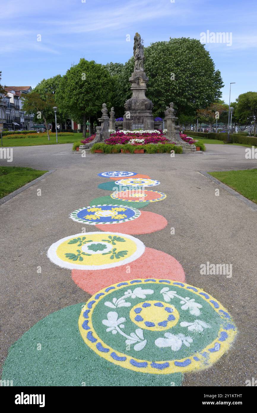 18th century statue of Viana with flower motives on the ground during the Flower festival, Viana do Castelo, Minho, Portugal, Europe Stock Photo