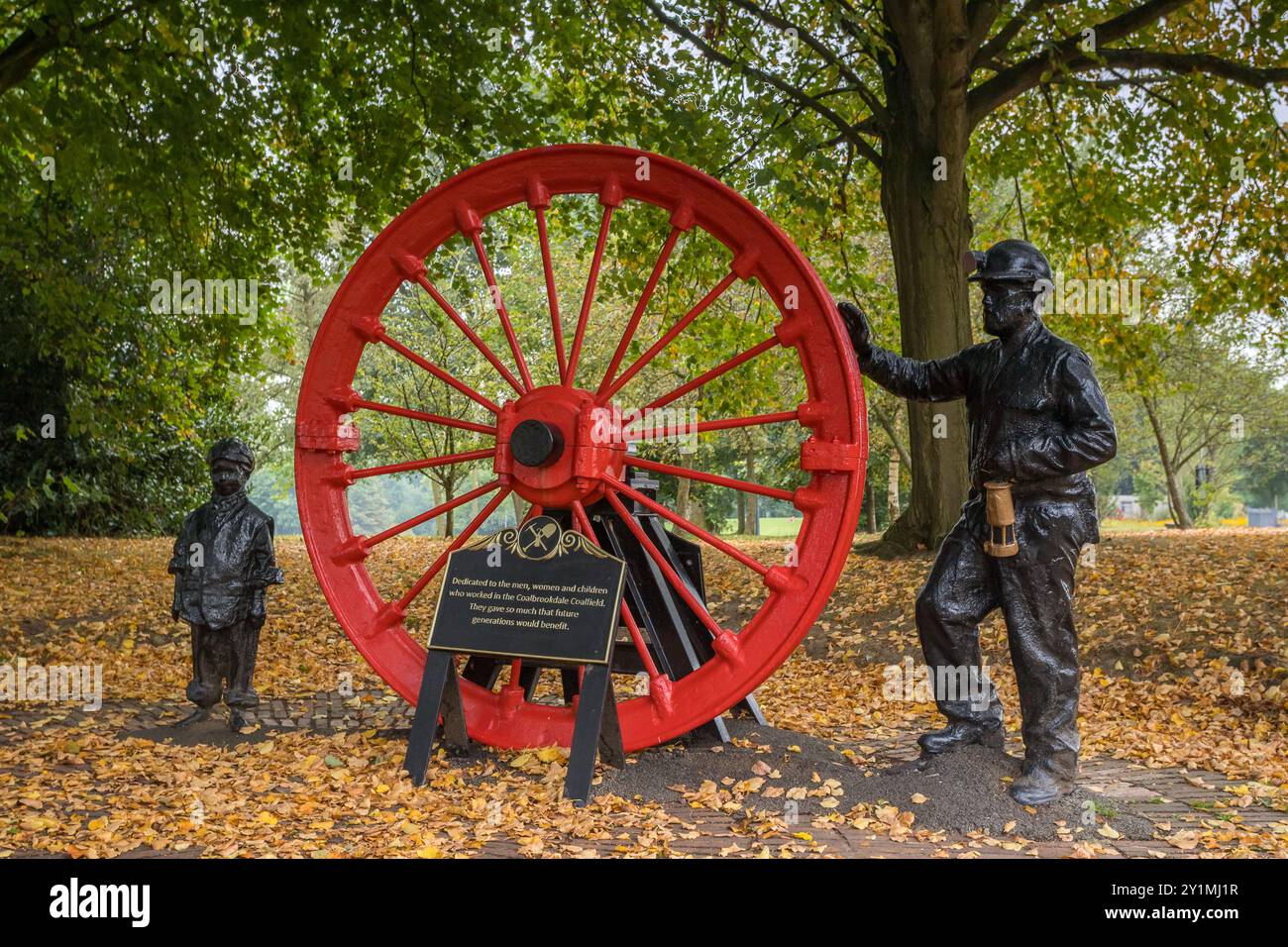 Close up of the Coalbrookdale coal monument in Telford Town Park, Shropshire captured on 7 September 2024 featuring figures of a coal miner with a you Stock Photo