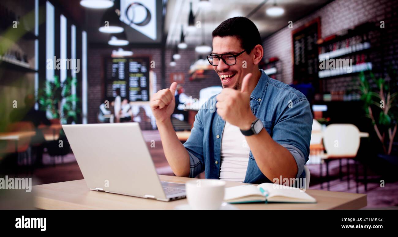 Excited Business Analyst Using Laptop Computer And Celebrating Win Stock Photo
