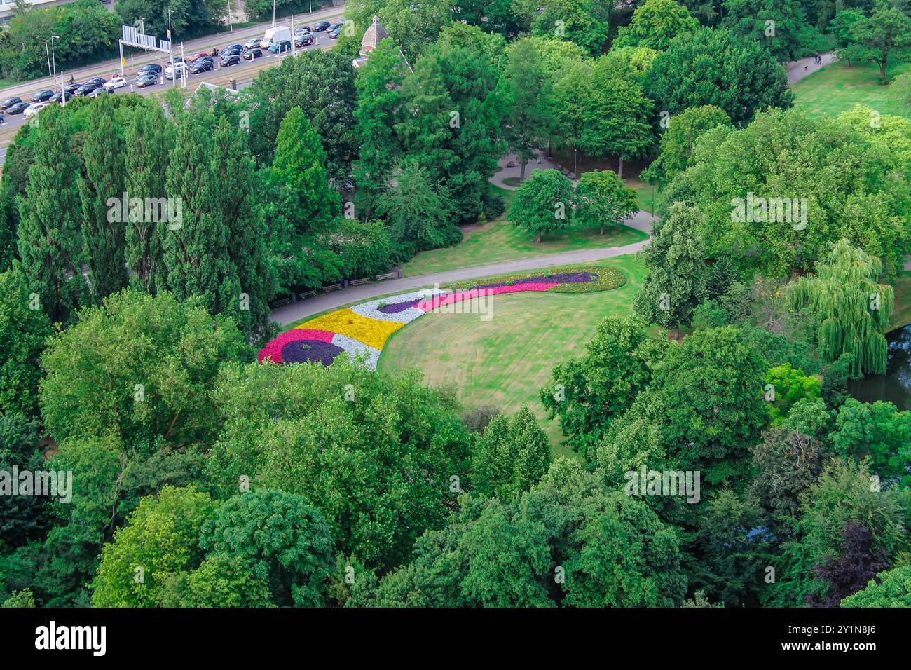Aerial view of a vibrant park featuring colorful flower beds arranged ...