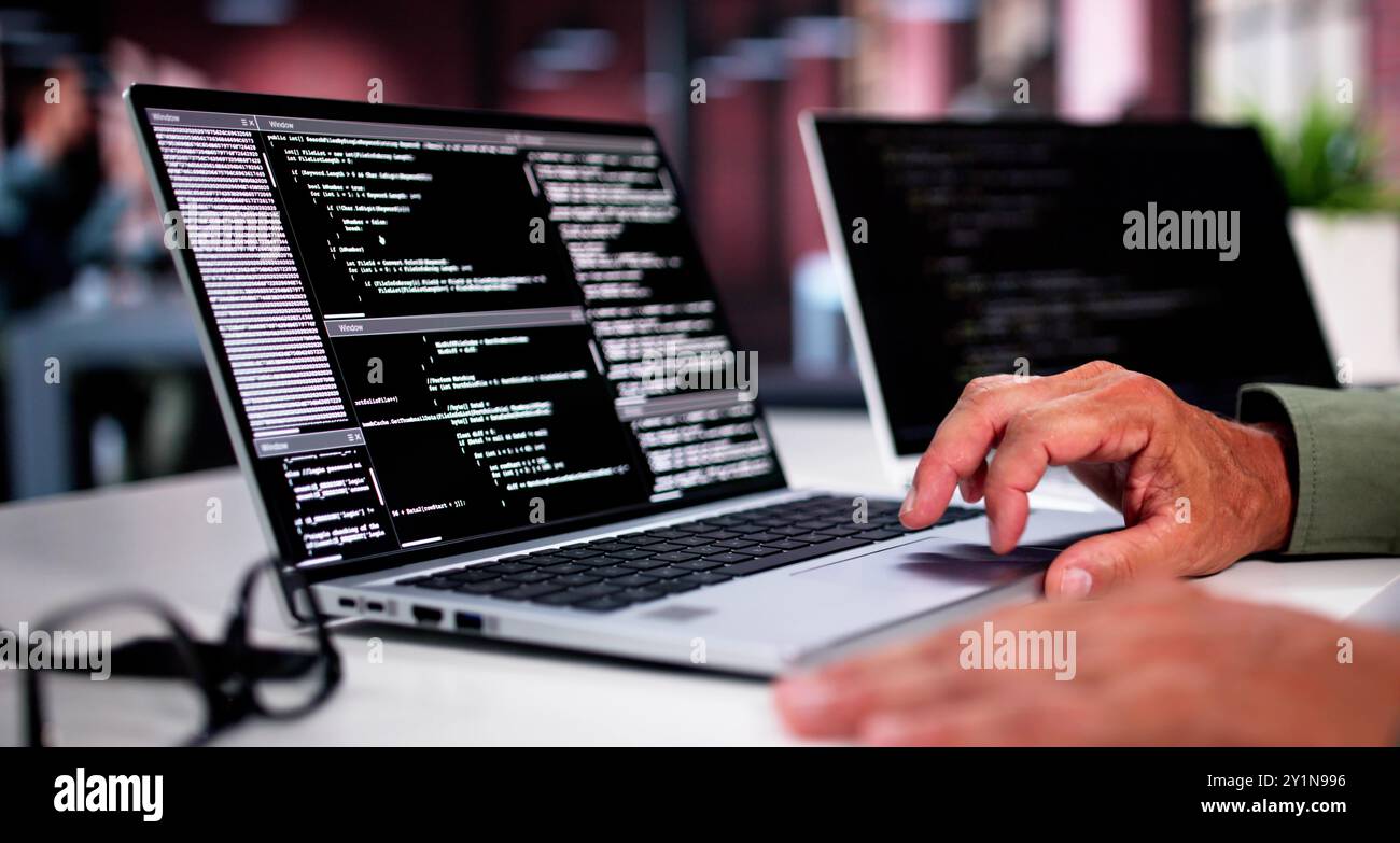 Overemployed Man Working Two Full Time Jobs Stock Photo