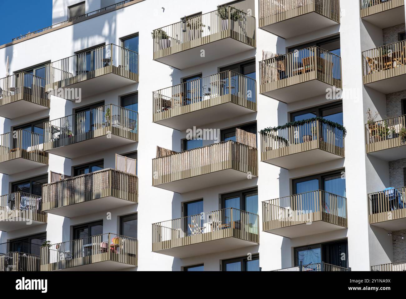 The facade of a modern apartment building with balconies seen in Berlin ...