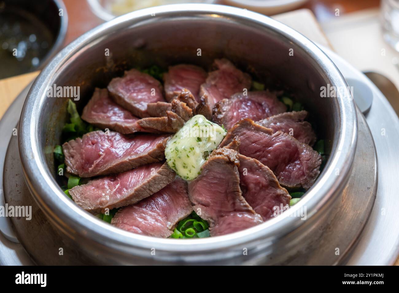 Steamed Beef Rice Rare beef rice in a steamed pot with butter. Korean food Stock Photo ...