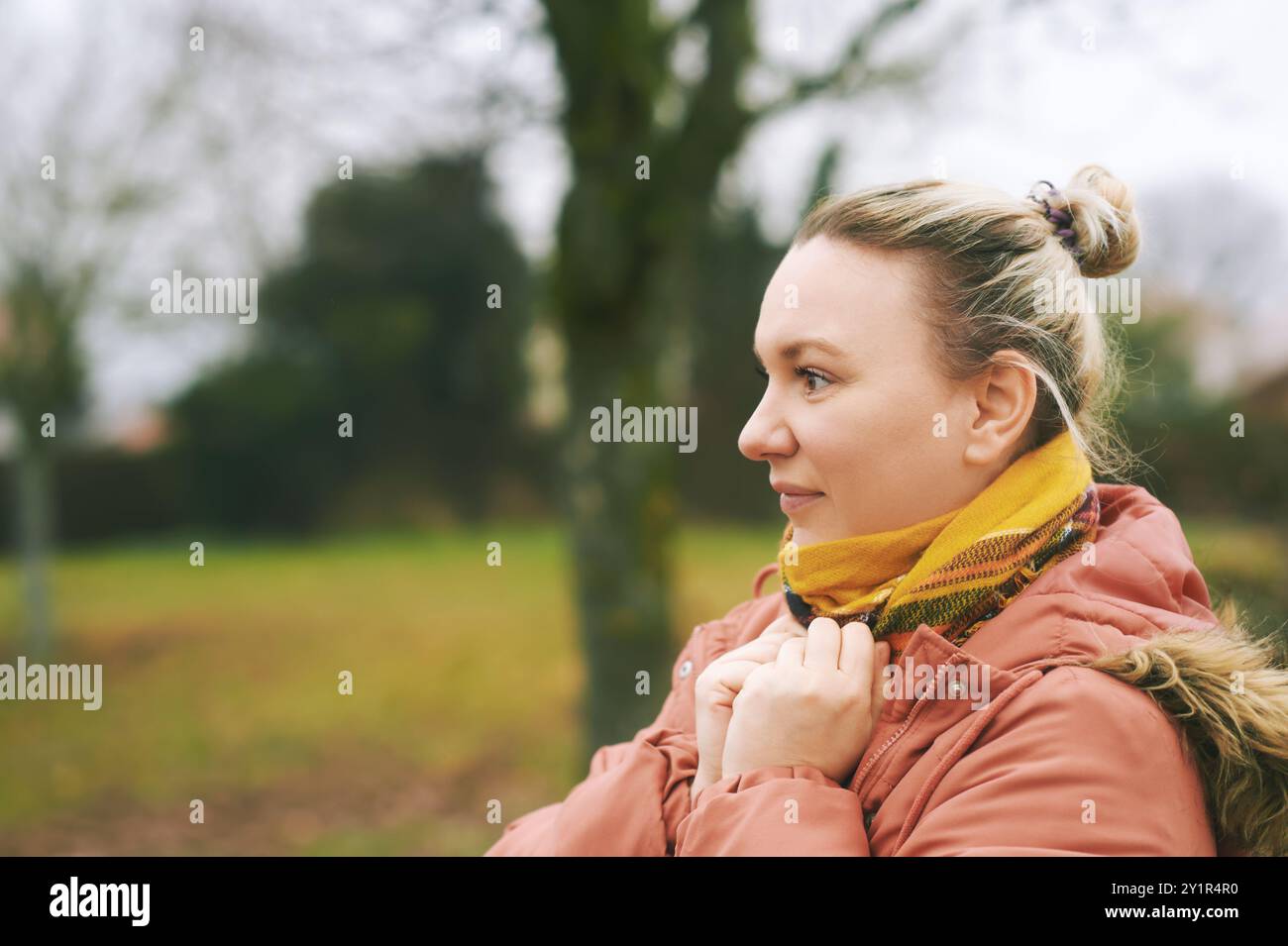 Outdoor portrait of middle age 35 - 40 year old woman enjoying nice ...