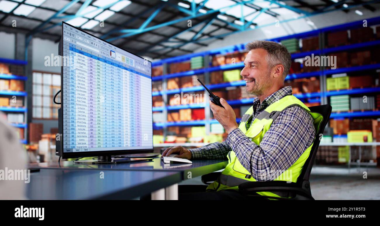 Warehouse Inventory Management On Computer. Staff In Office Stock Photo