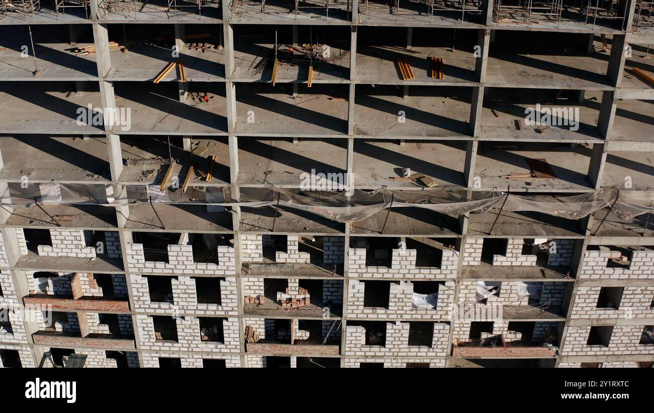 Construction site background. Hoisting cranes and new multi-storey ...