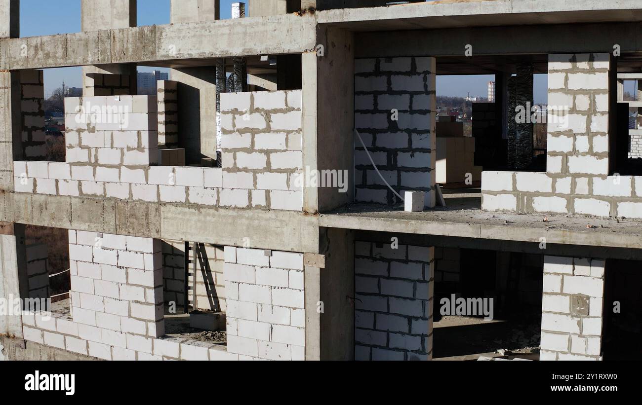 Construction site background. Hoisting cranes and new multi-storey ...