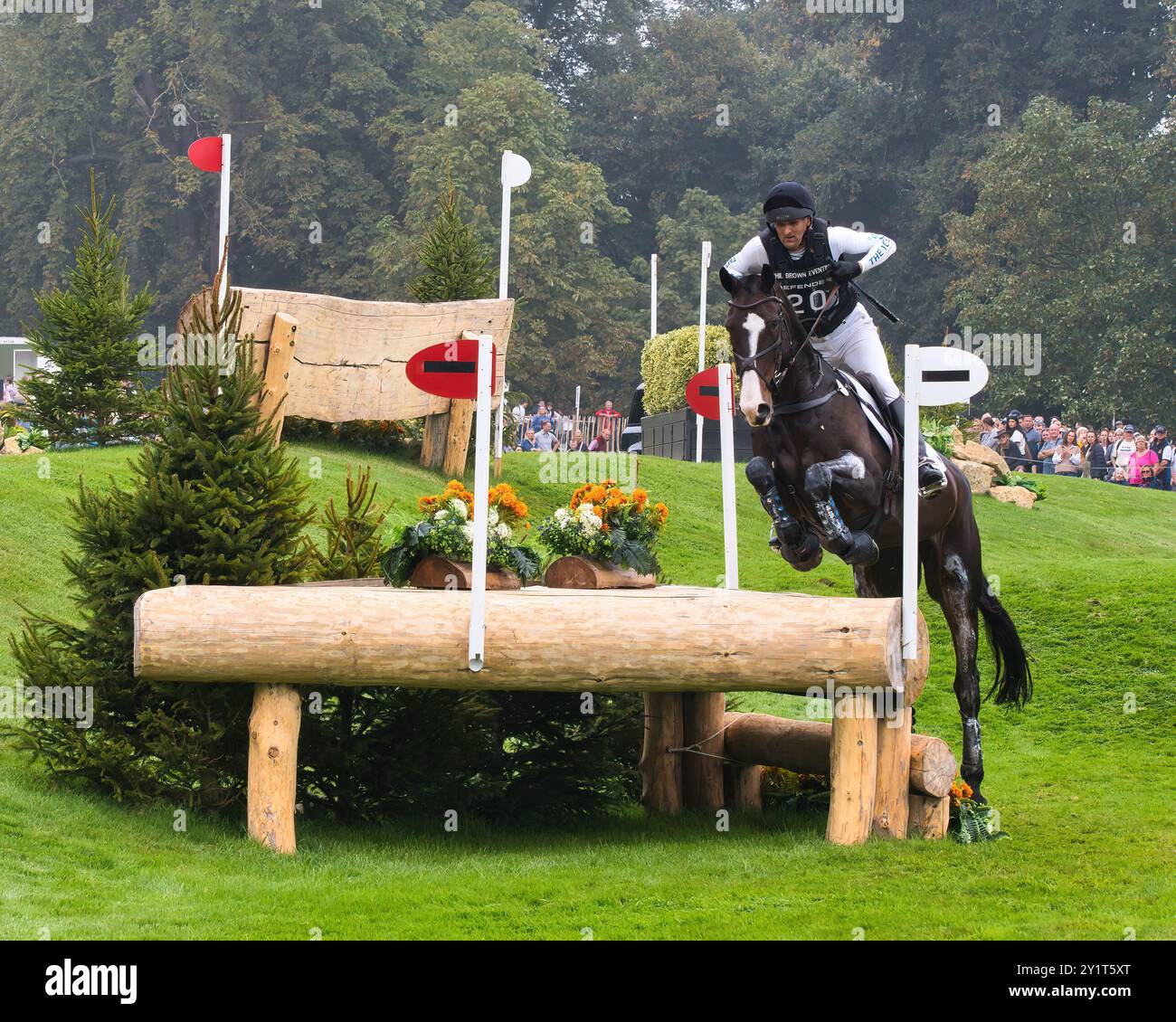 Philip Brown on Harry Robinson on the cross country course of Burghley