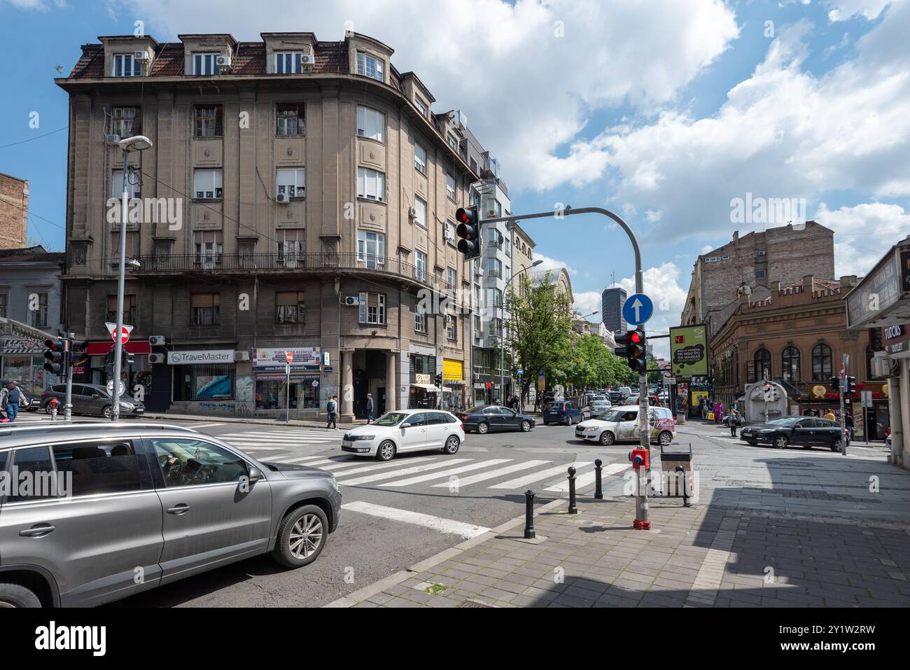 Everyday life on a Belgrade street,  people walking about and traffic driving around.  April 2024. Stock Photo