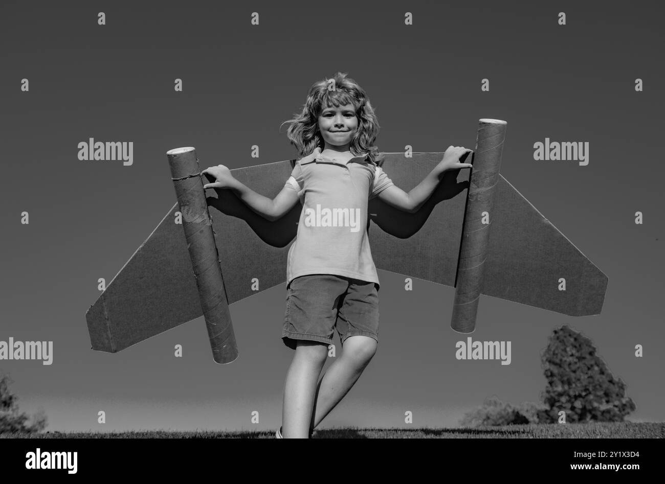 Happy boy playing toy jetpack Black and White Stock Photos & Images - Alamy