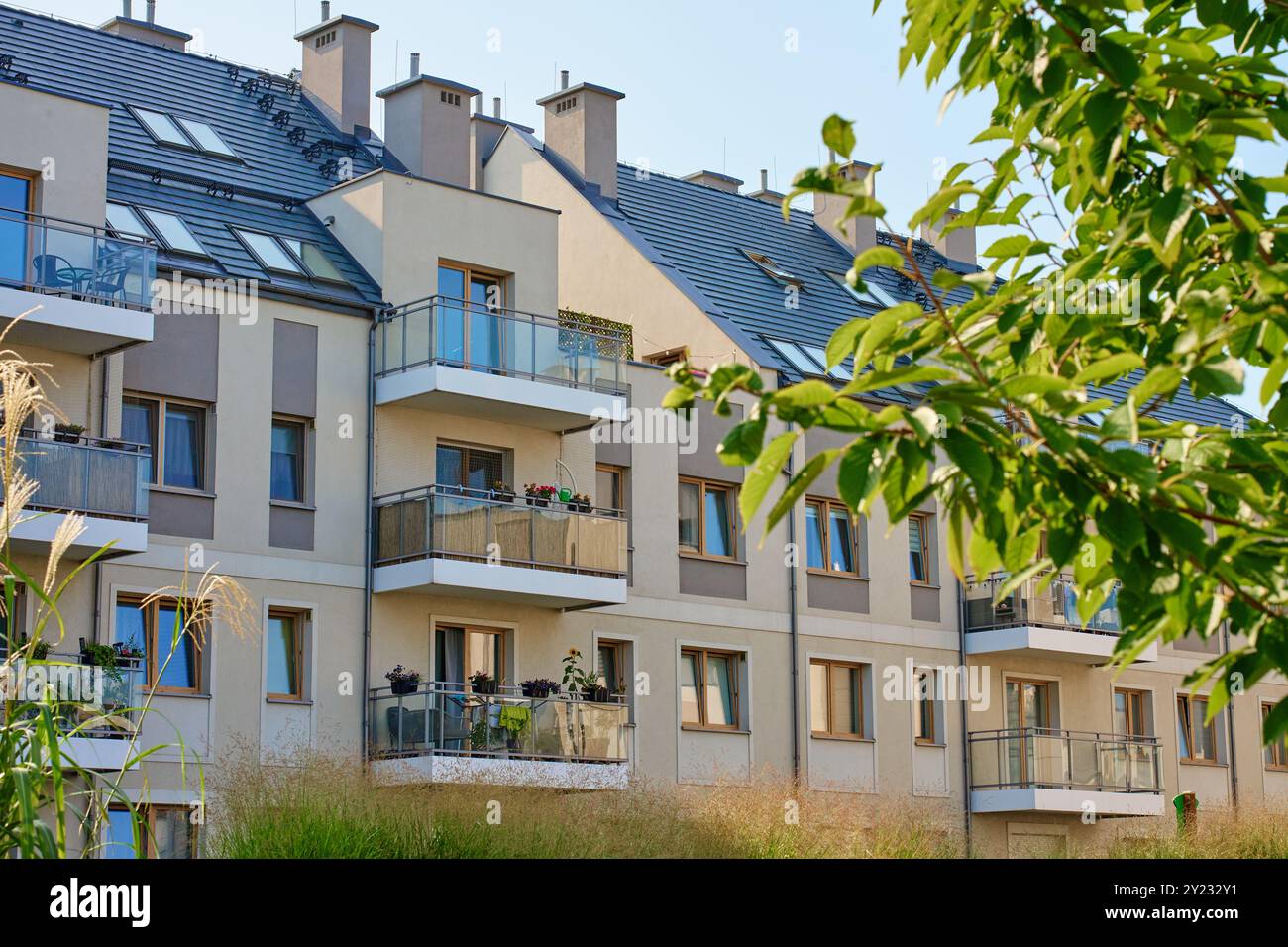 Residential building facade with balconies and windows. Modern city ...