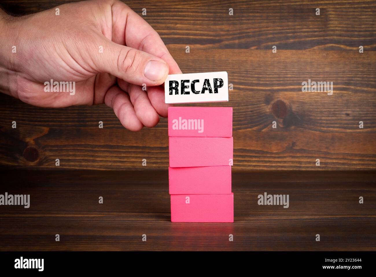 Recap Concept. Colorful stack of blocks on wood texture background ...
