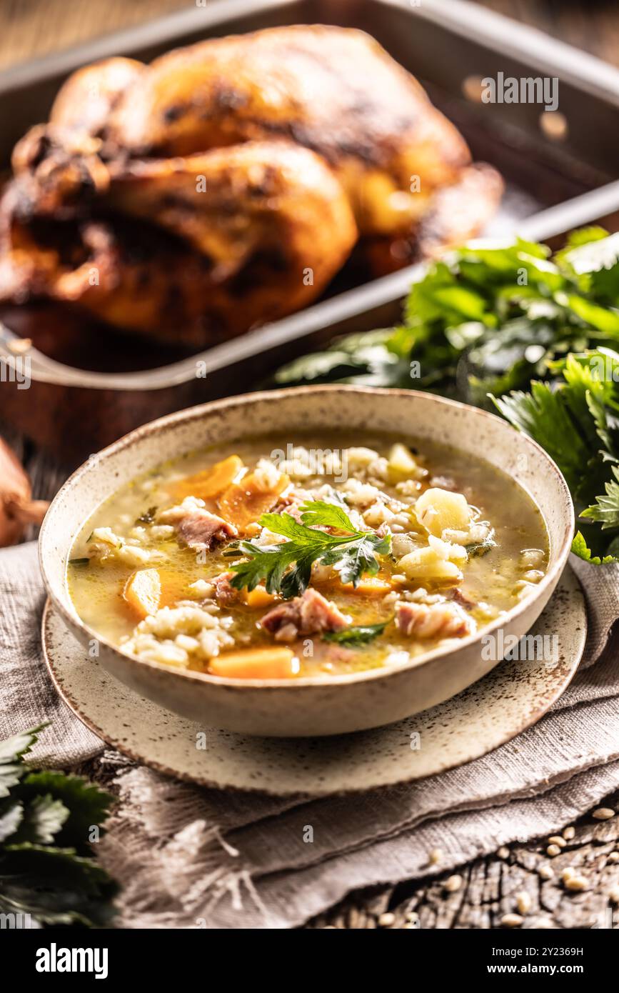 Soup made from barley groats, smoked pork neck, potatoes and root vegetables. Stock Photo