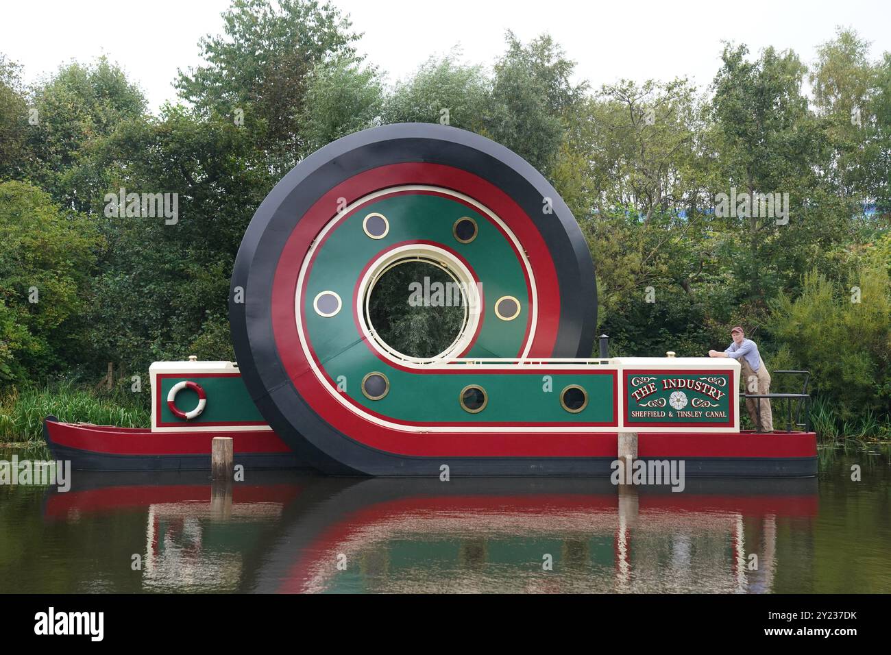 Artist Alex Chinneck with his sculpture of a canal boat after being ...