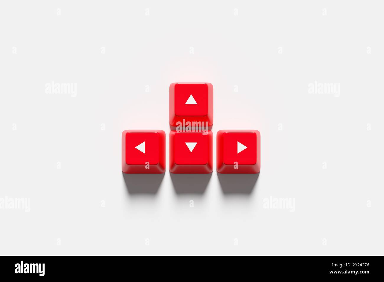 Four red keyboard arrow keys are laying on a white background, showing ... image.
