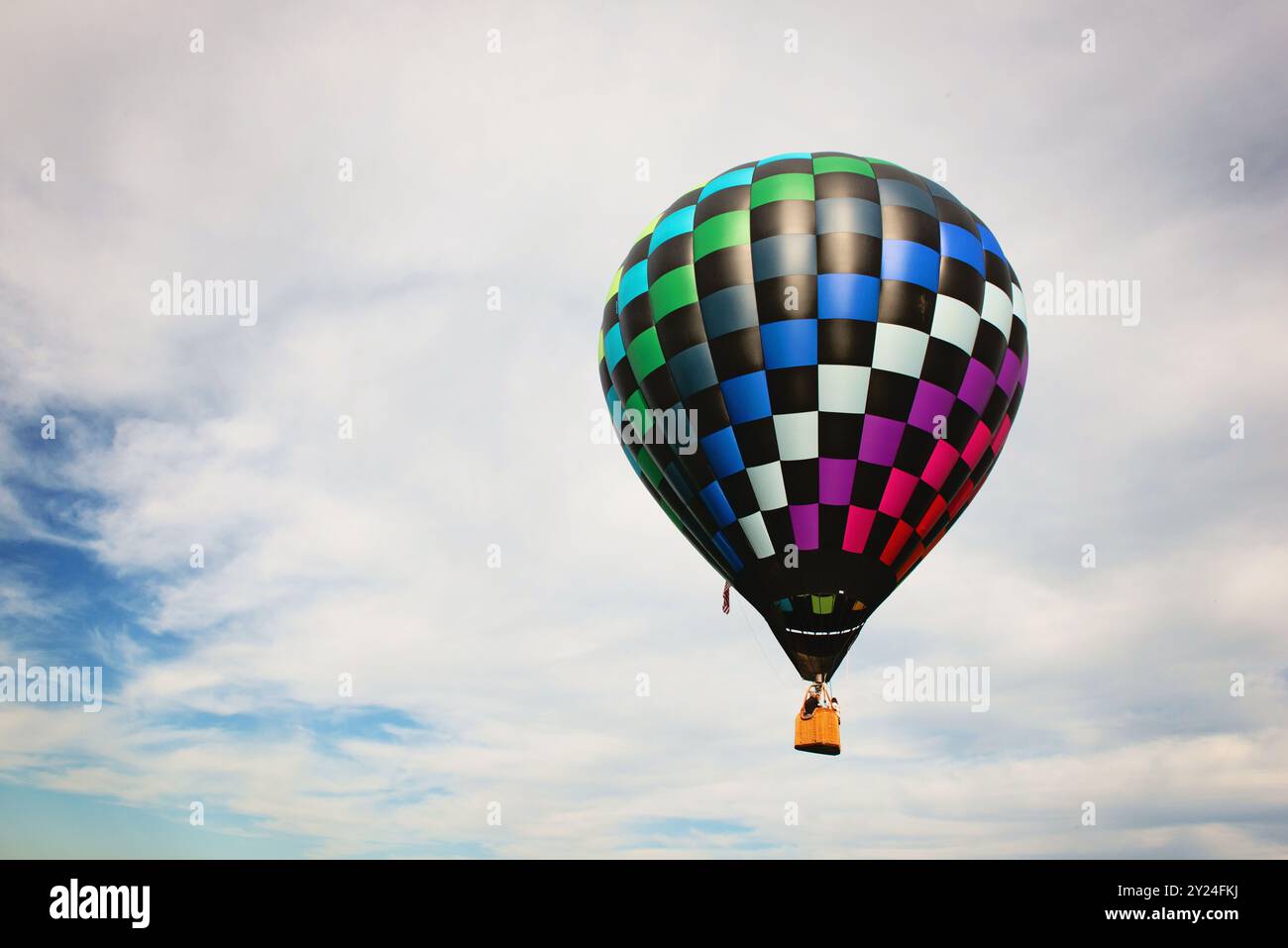 Hot air balloon against a blue sky with white clouds Stock Photo - Alamy