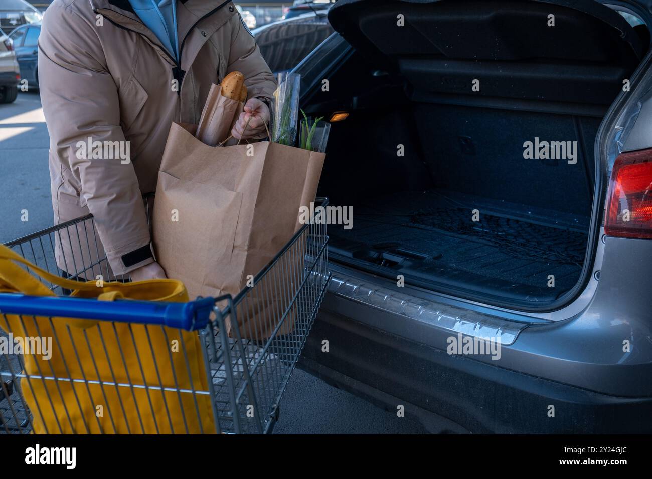 Man Loading Groceries into Car Trunk Stock Photo - Alamy