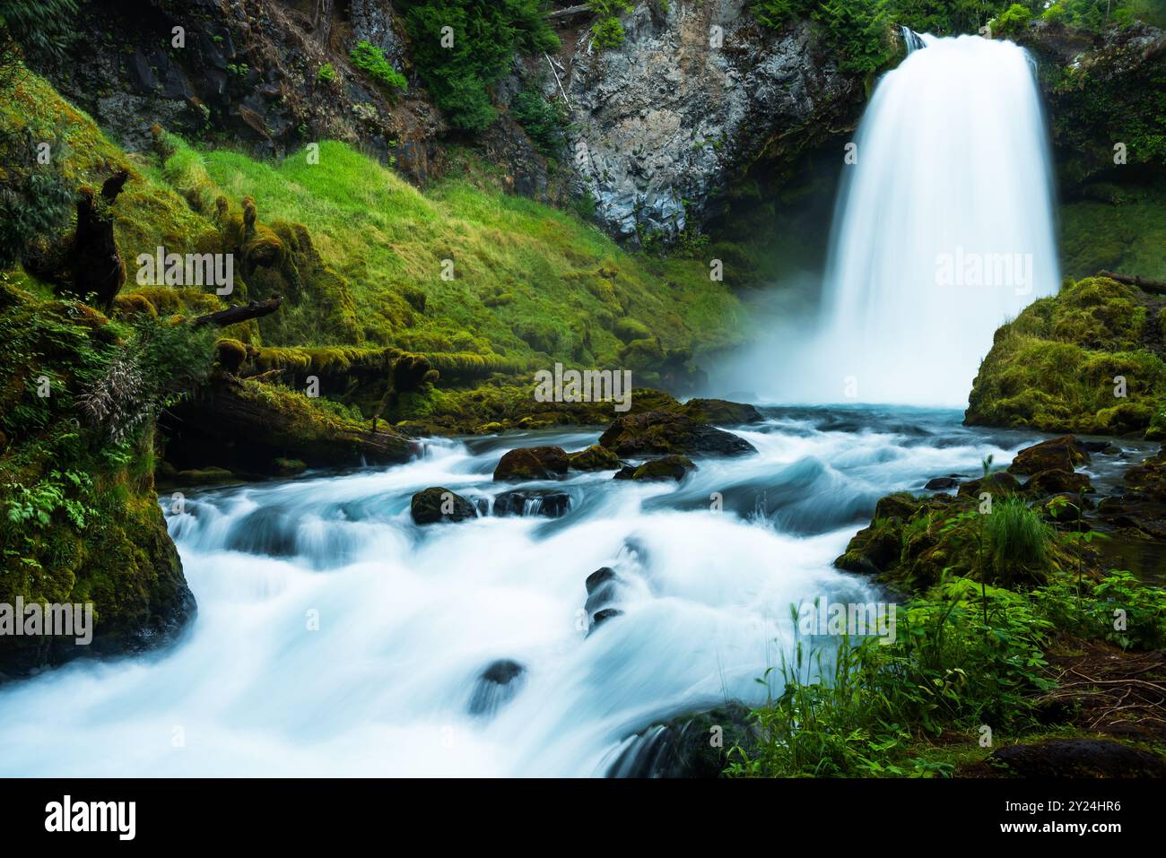 Serene waterfall cascading through lush hi-res stock photography and ...