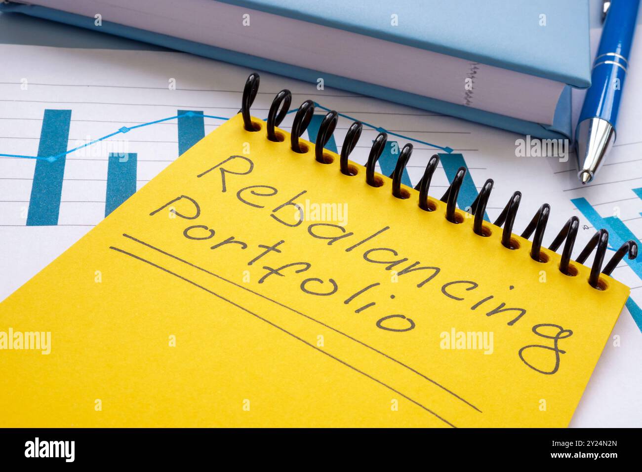 Rebalancing portfolio note on papers. Investment strategy Stock Photo ...