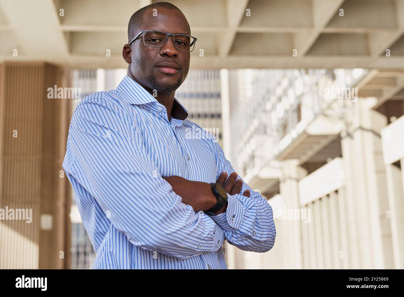 Confident Young Professional in Urban Setting Stock Photo