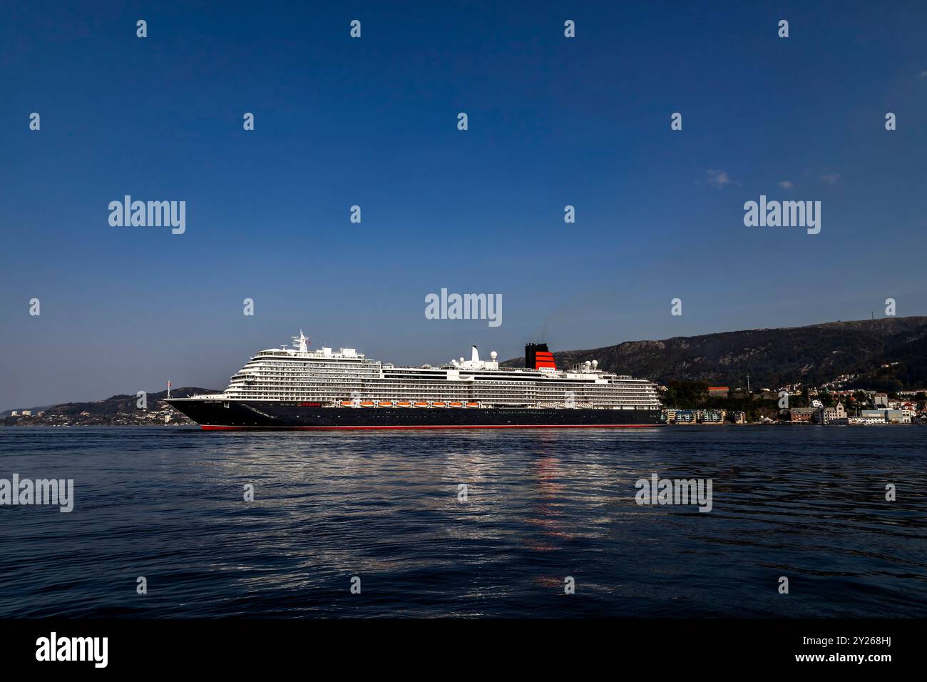 Cruise ship Queen Anne at Byfjorden, departing from the port of Bergen, Norway. Stock Photo