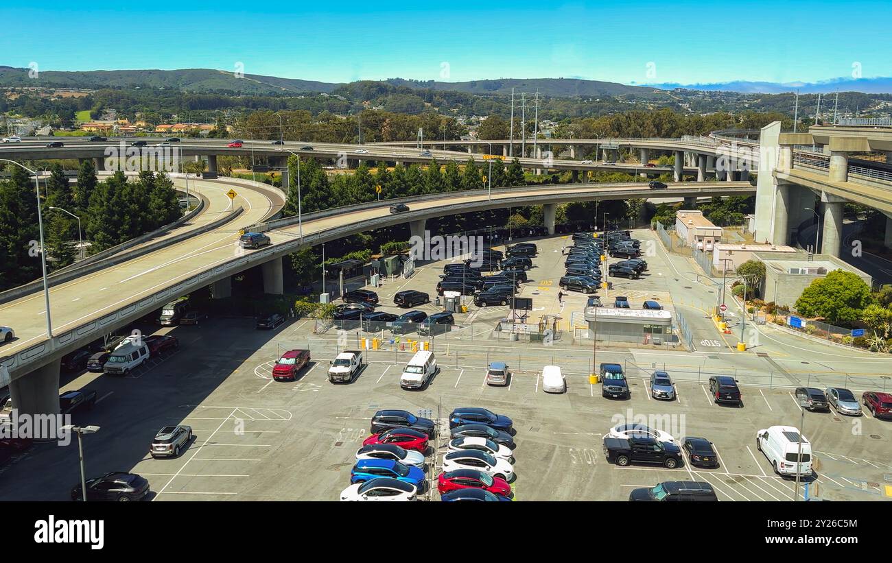 San Francisco, California, USA. August 2, 2024. Overhead view of parking lots and elevated highways near San Francisco International Airport. Stock Photo