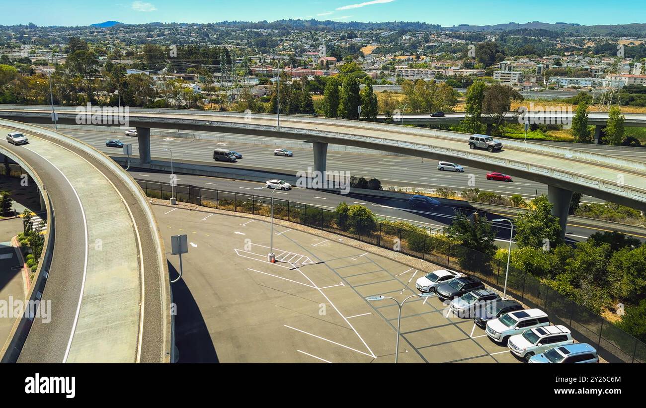 San Francisco, California, USA. August 2, 2024. Overhead view of parking lots and elevated highways near San Francisco International Airport. Stock Photo