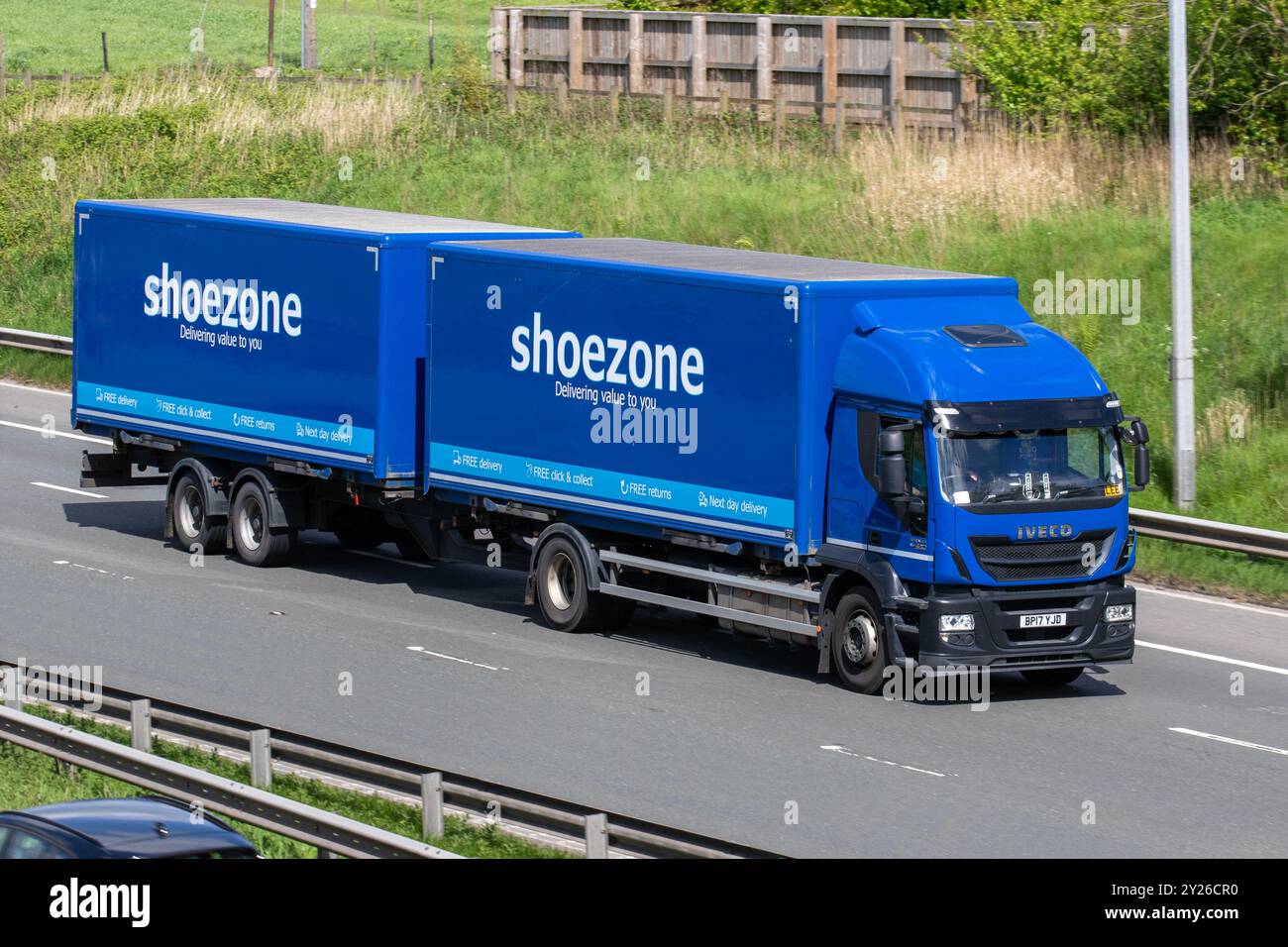 ShoeZone  budget footwear retailer HGV with trailer travelling on the M6 motorway, UK Stock Photo