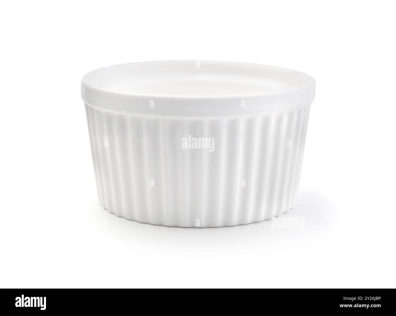 New empty ceramic white ramekin isolated on white. Stock Photo