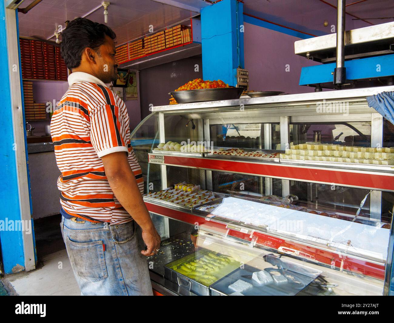 Shop selling traditional indian sweets at Kaladhungi, Uttarakhand, India Stock Photo