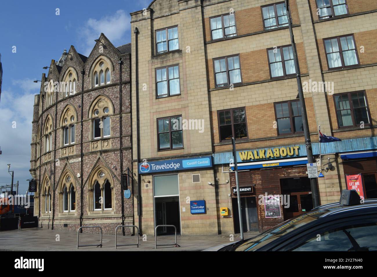 Wetherspoon The Great Western Pub, Travelodge Hotel, and Walkabout Bar on St Mary Street. Cardiff, Wales, United Kingdom. 18th July 2024. Stock Photo