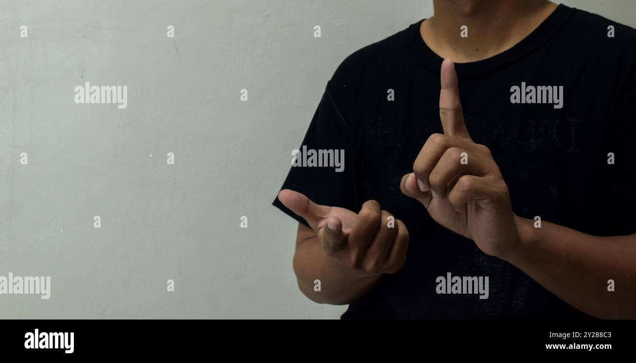 young man learning sign language Stock Photo